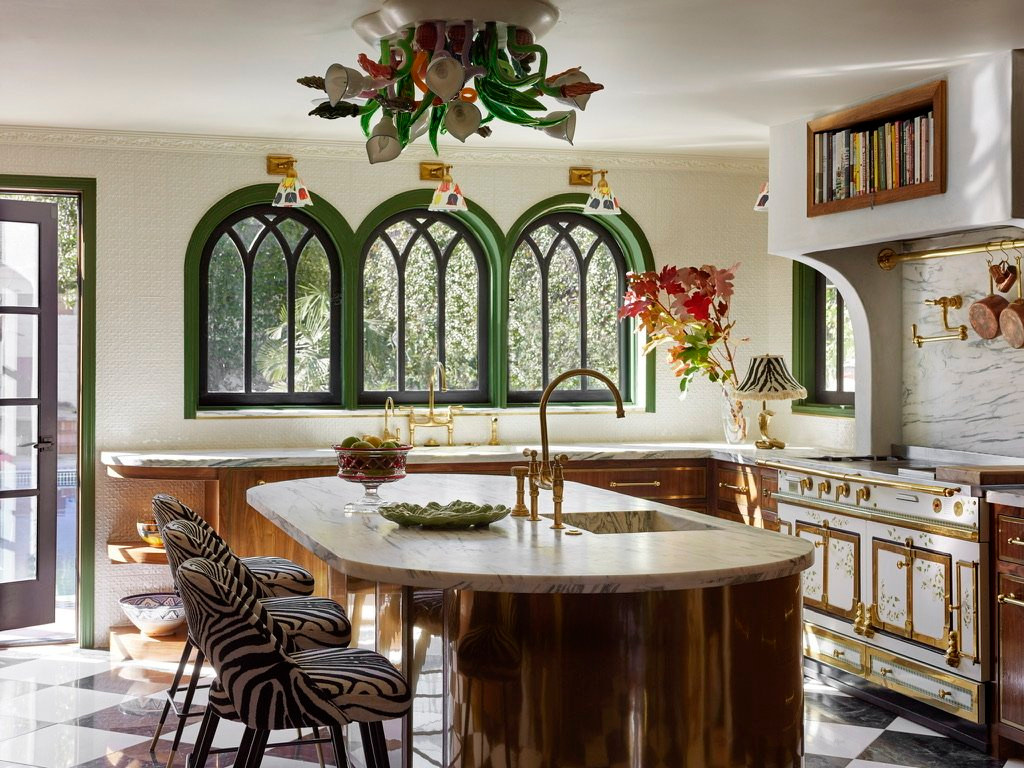 Berendo project kitchen with arched windows, a chandelier, and lush greenery, a Studio Nauleau renovation in Los Feliz